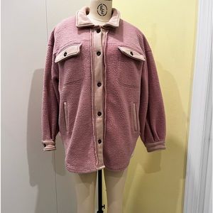 Pale pink fleece shacket by Chelsea & Violet, sold at Dillards.